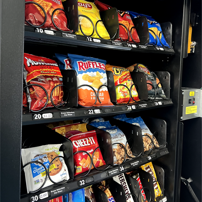 a vending machine filled with bags of chips and snacks