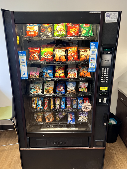 a vending machine filled with a variety of snacks