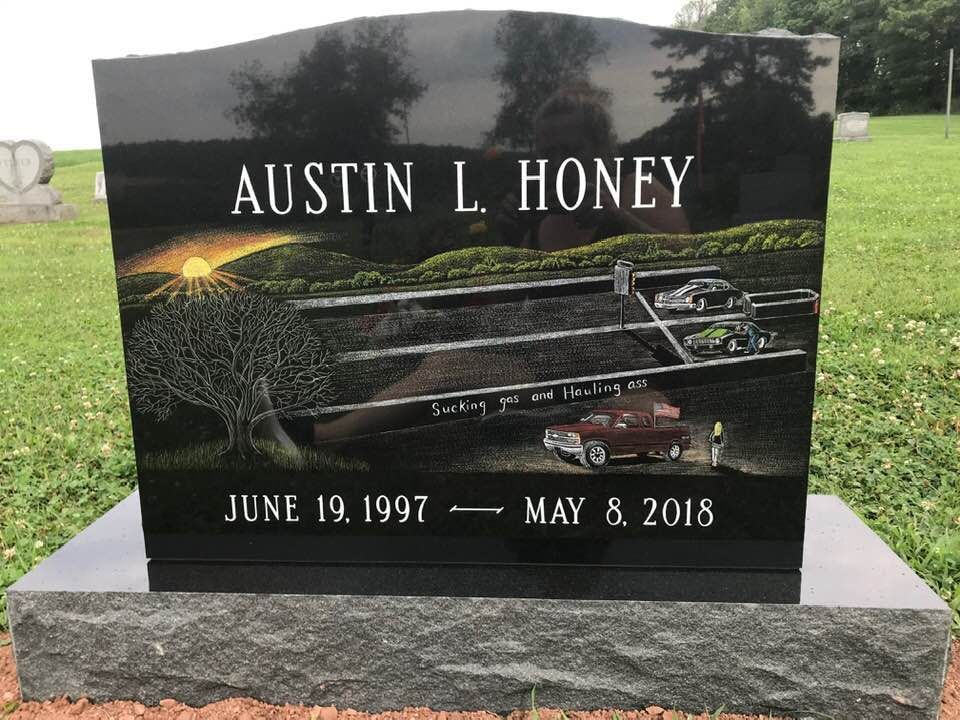 A gravestone for austin l honey in a cemetery