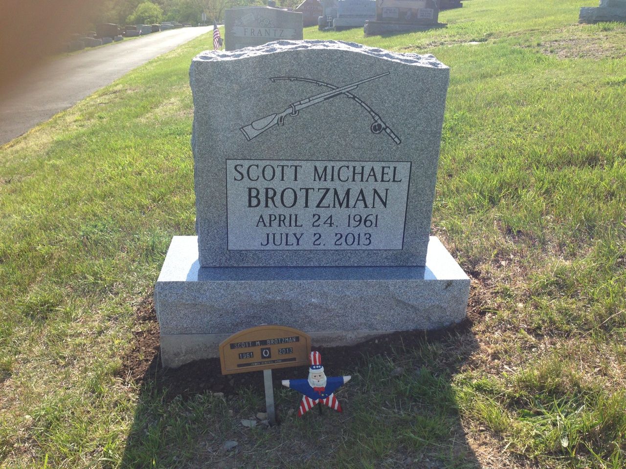 A gravestone for scott michael brotzman in a cemetery