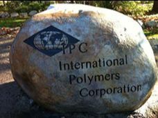 A large rock with the words `` international polymers corporation '' written on it.