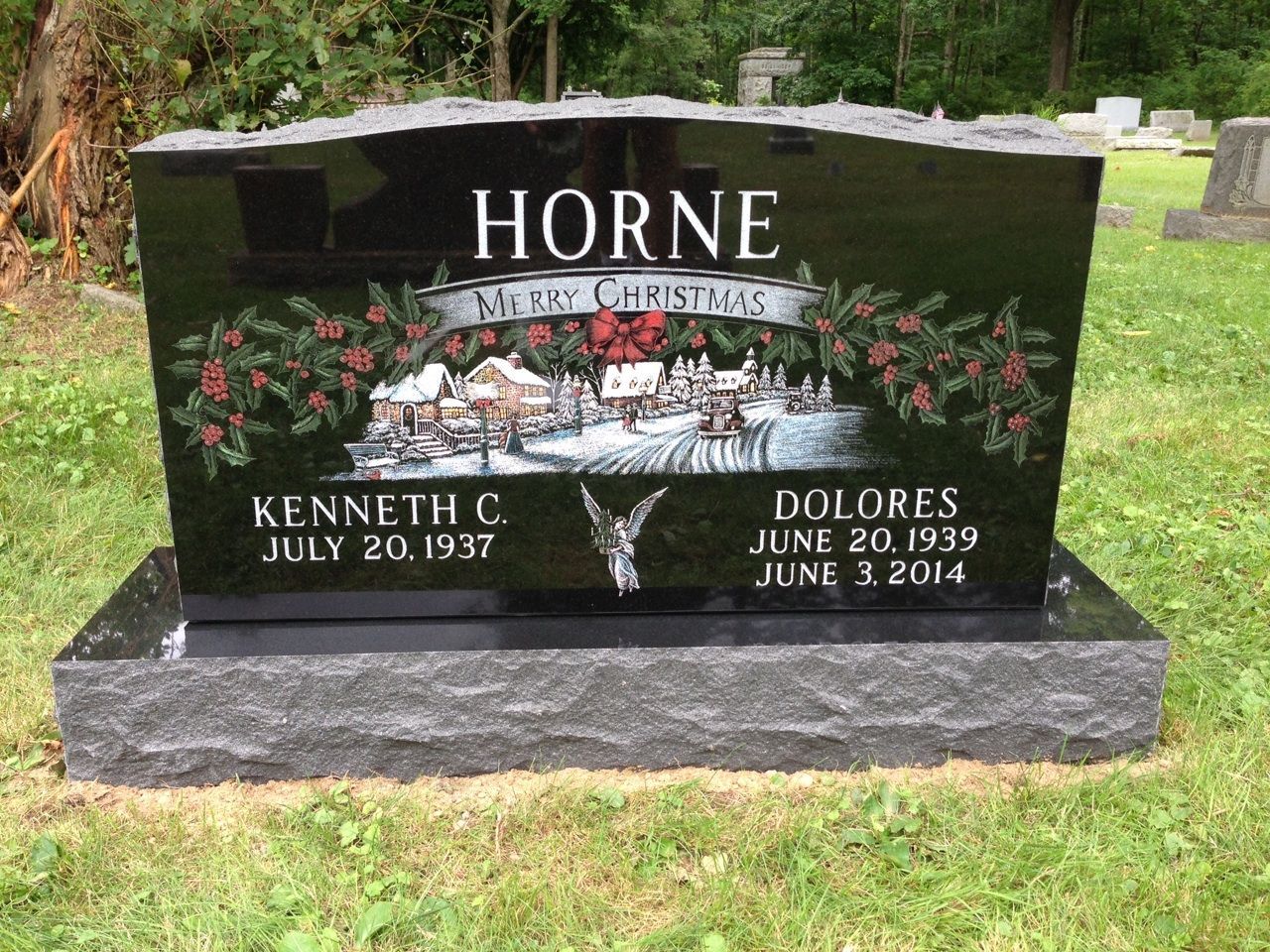 A black gravestone with the name horne on it