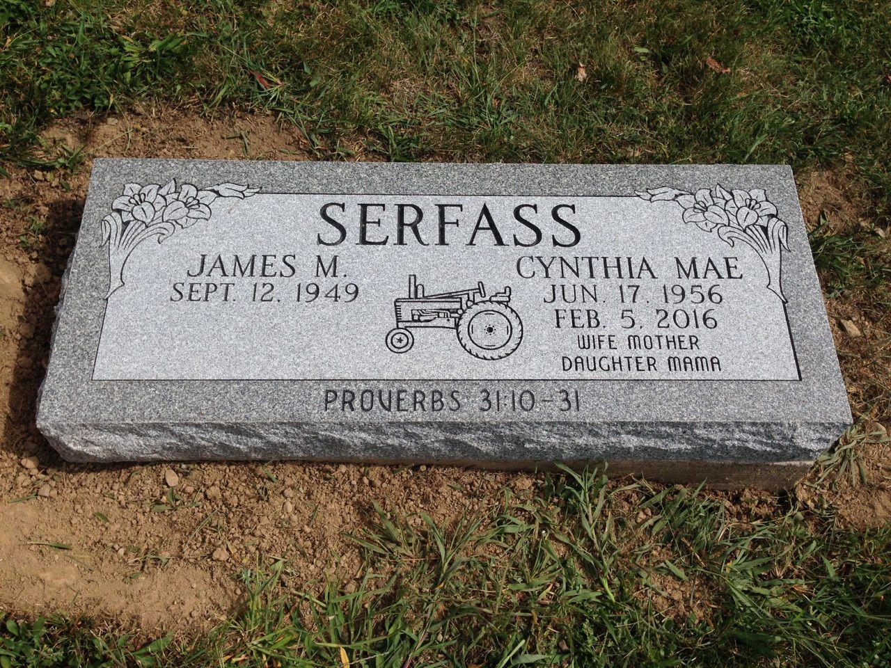 A gravestone for james m. serfass with a picture of a tractor on it.