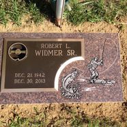 A gravestone for robert l. widmer sr. with a picture of a man fishing.