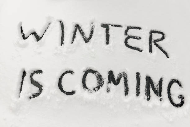 The words winter is coming are written in the snow