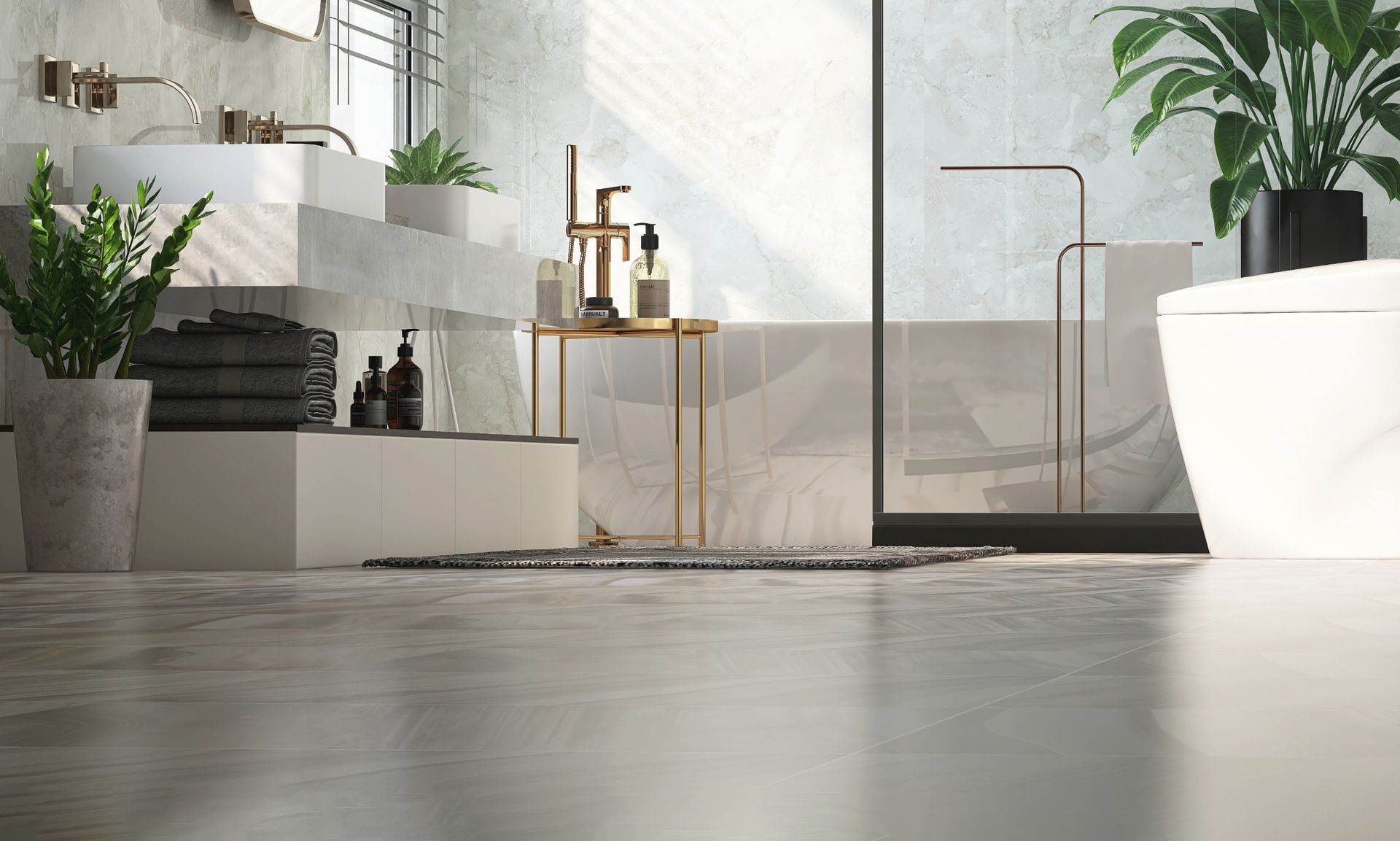 A modern, bright bathroom with polished concrete floors, double vanity, plants, and a freestanding white bathtub.