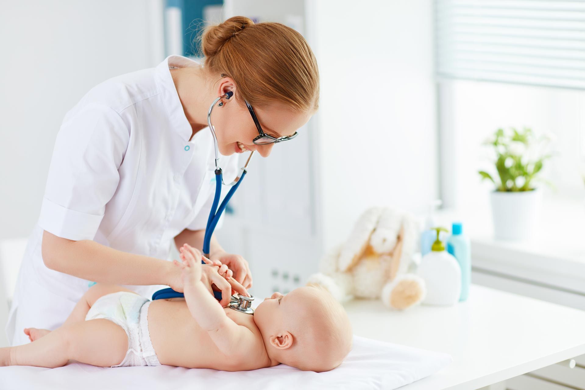 Doctor pediatrician and baby patient