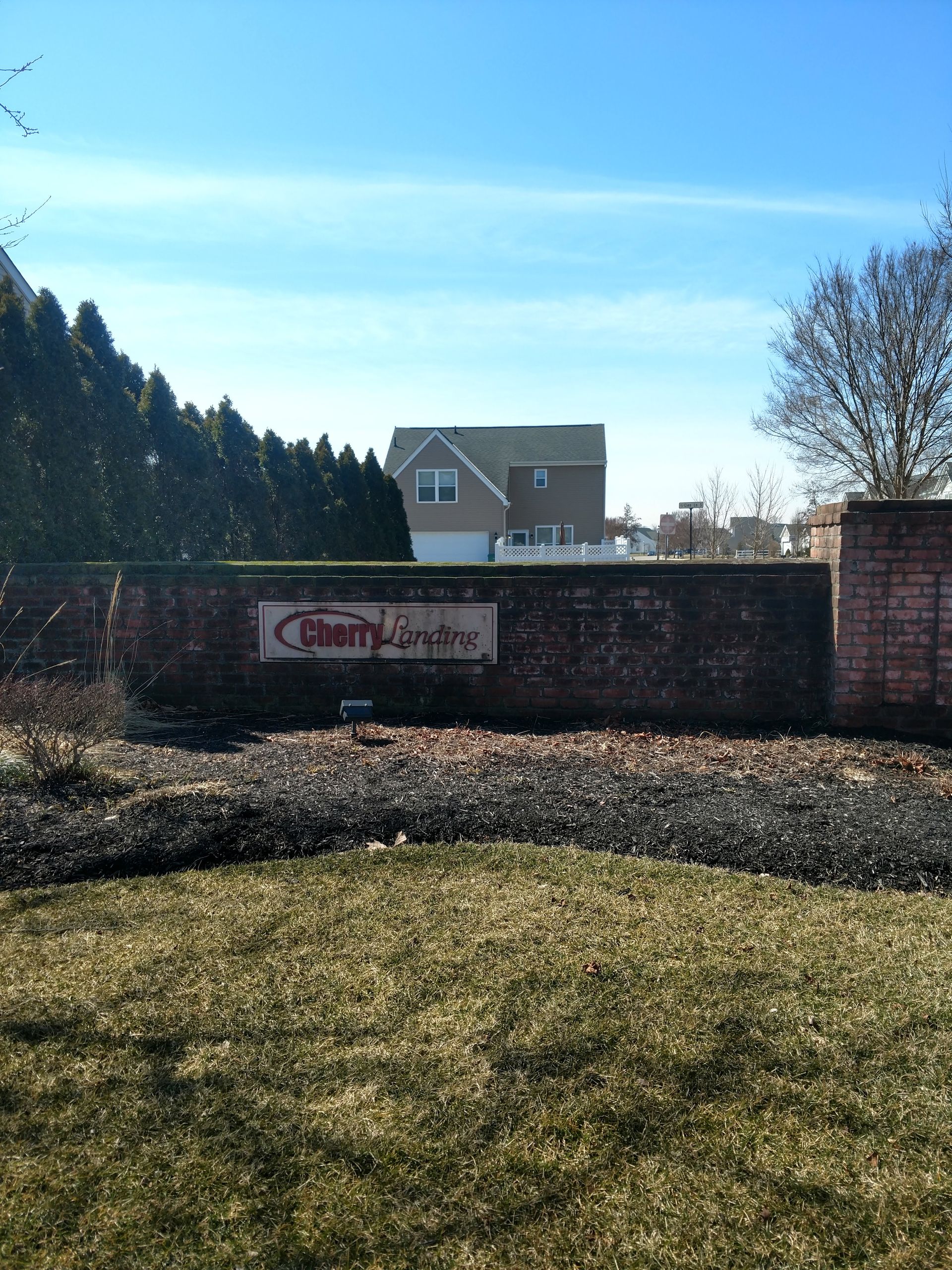 A brick wall with a sign that says country empire