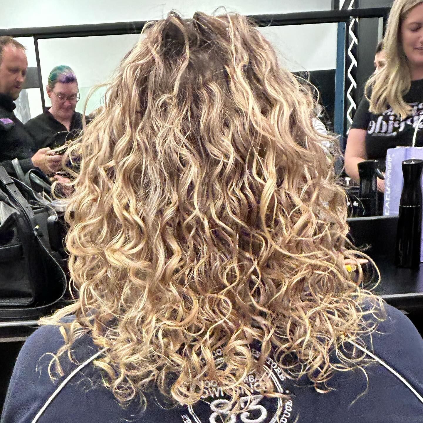 Woman With Curly, Light Brown Hair at a Salon — Wow! Excellence in Hair in Toowoomba, QLD