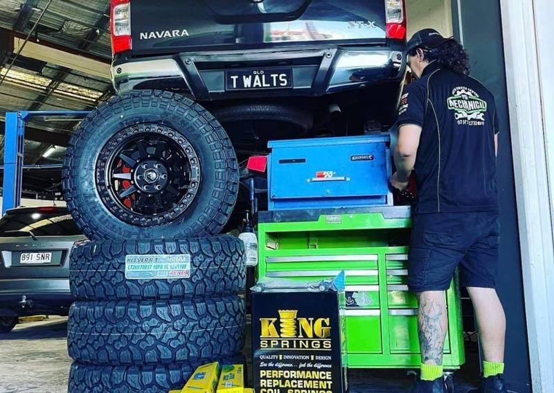 Mechanic Working On A Black Off-road Vehicle In A Garage — Mr Mechanical Auto Service Centre in Southport, QLD