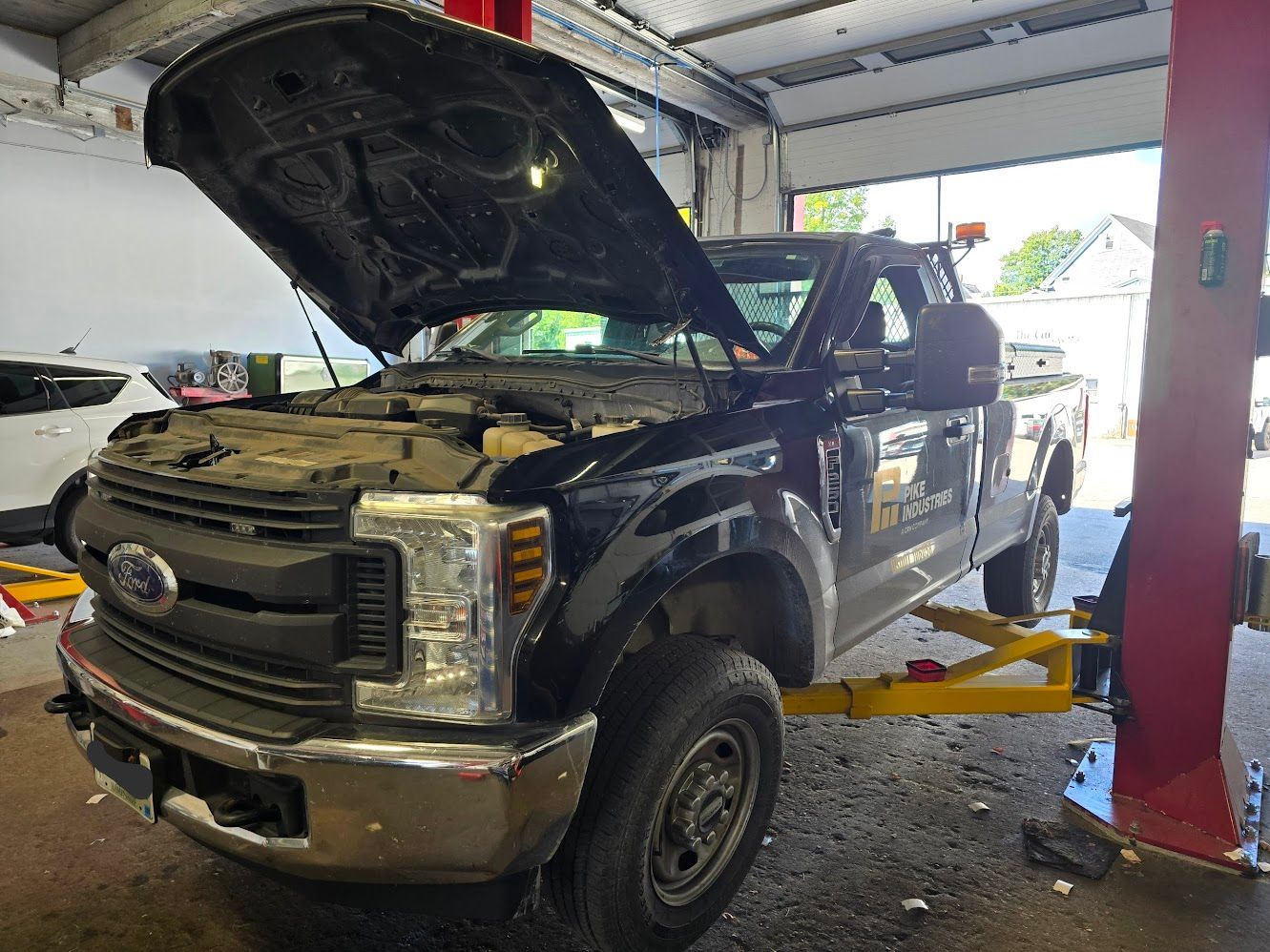 Black Fleet Pickup Truck In Service Bay | Garry's Fleet Services