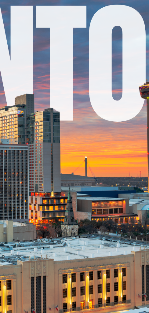 Skyline of San Antonio, Texas, with buildings and a sunset in the background.