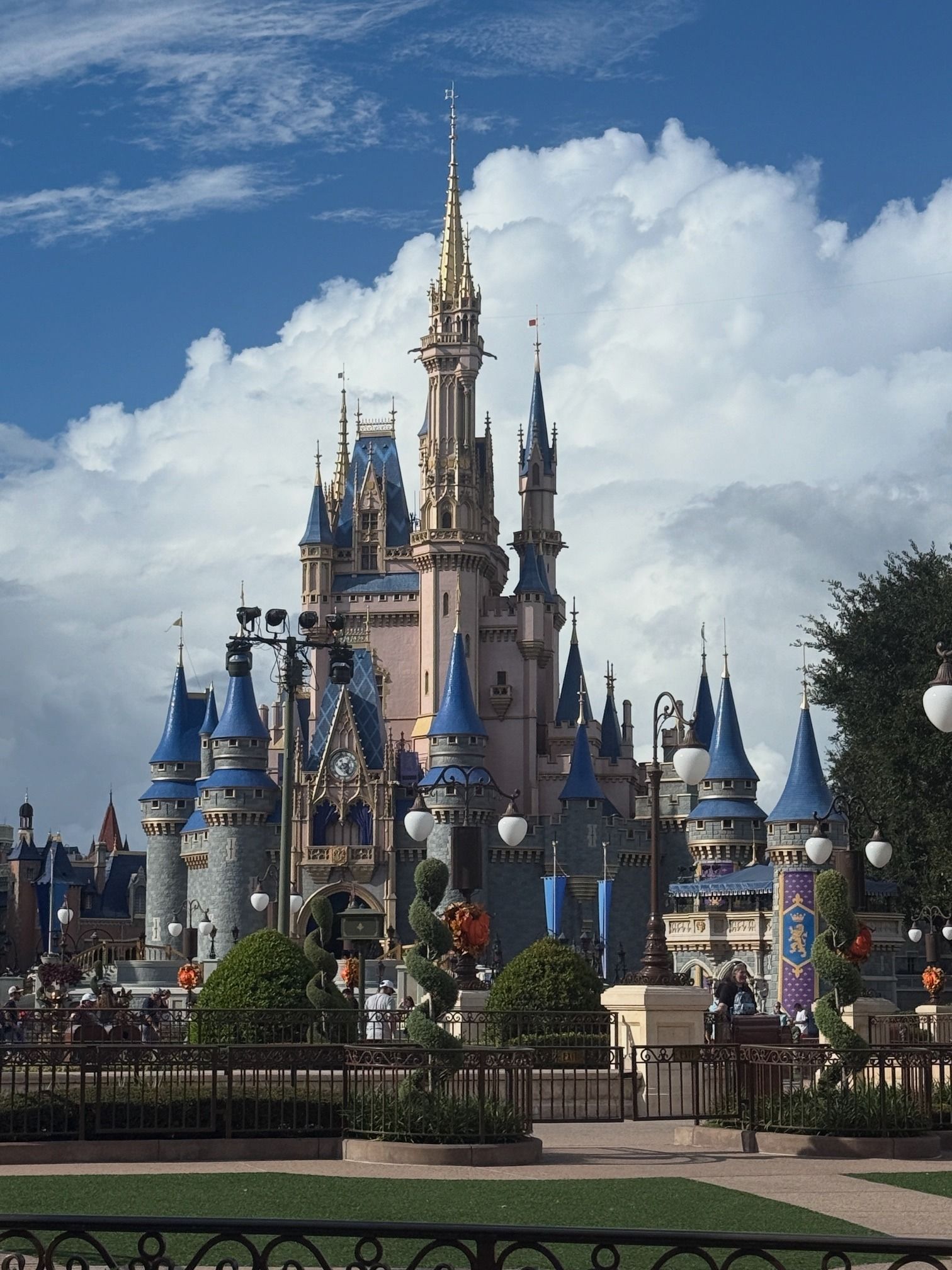 Cinderella Castle at Disneyland with blue turrets against a sunny sky