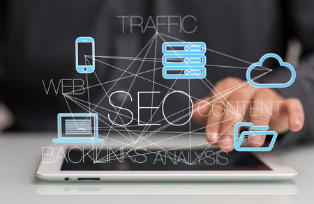 Person's hand on tablet with SEO-related icons, connected by lines: cloud, phone, server, web, and traffic.