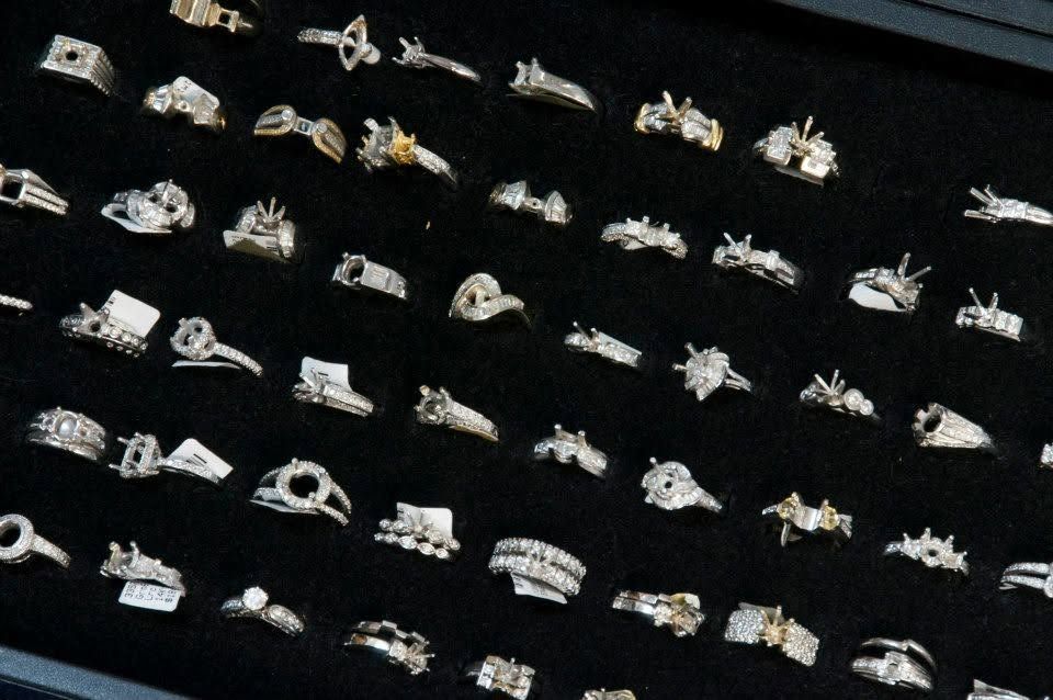 Rows of small white model aircraft arranged diagonally on a black background
