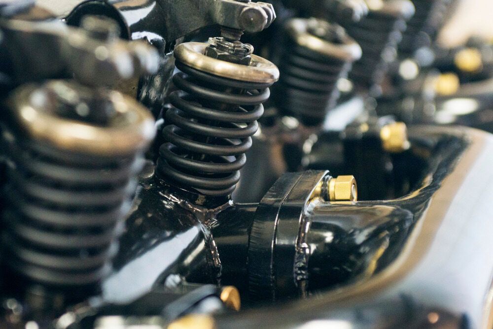 A Close up Of a Car Engine with Coil Springs — Multidrive Parts Australia in Taminda, NSW
