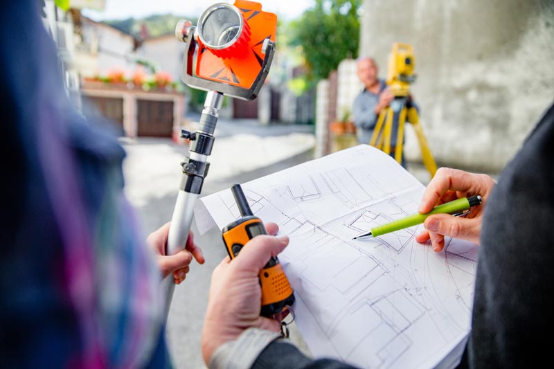 Yellow Surveyor Equipment — Floresville, TX — Polluck & Sons Surveying Inc.