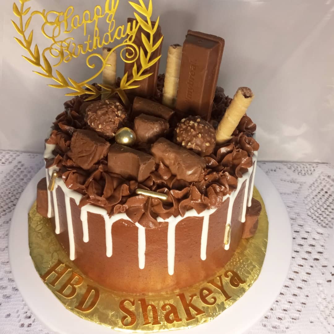 A chocolate cake with the name shakeya on it