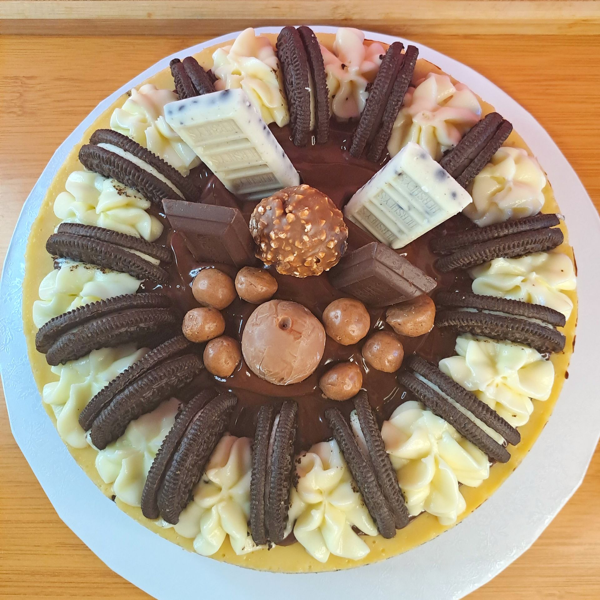 A cake with oreos and chocolate on it