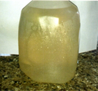 A large, translucent jug filled with a cloudy, yellow-brown liquid.
