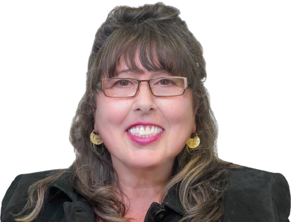 Woman with glasses smiles; wearing black blazer, and gold earrings.