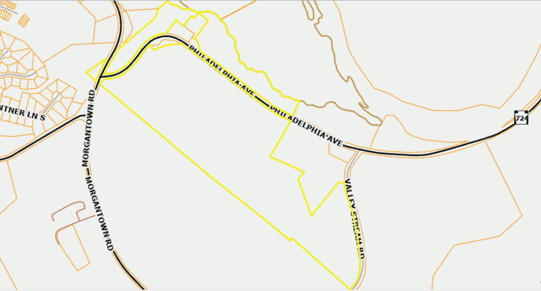 Map view with yellow outlined route through a rural area and roads on a light background