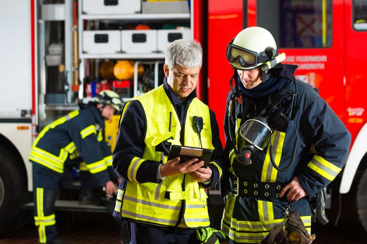 fire police looking at the tablet