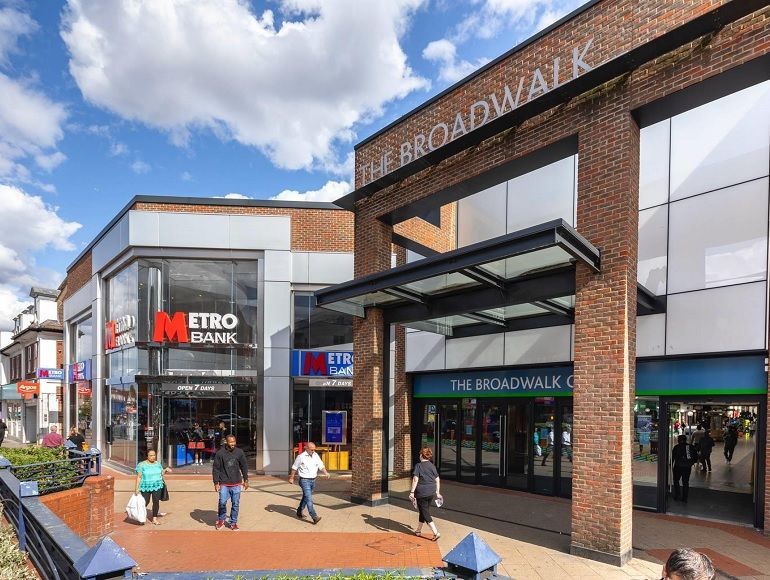 The Broadwalk Shopping Centre entrance and Metro Bank on Station Road, Edgware