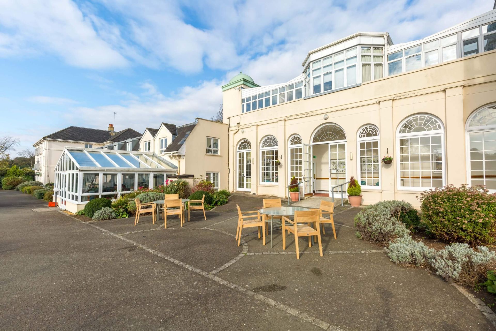 Bushey House, a grand period building with a conservatory and terrace in Bushey