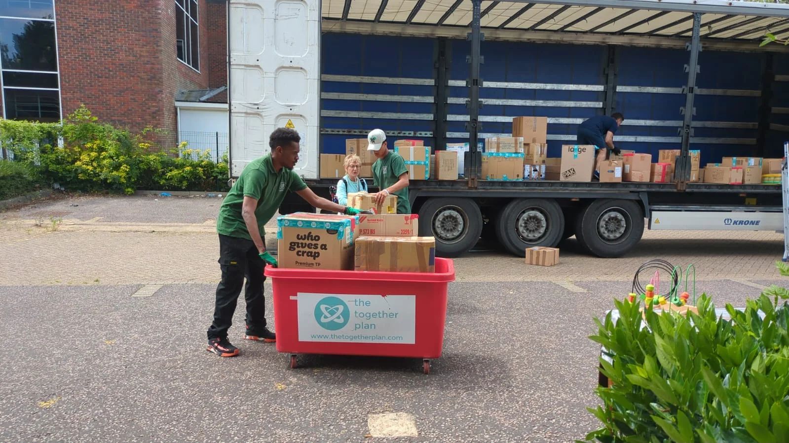 Light Rock Removals crew loading donated boxes into a lorry for The Together Plan charity