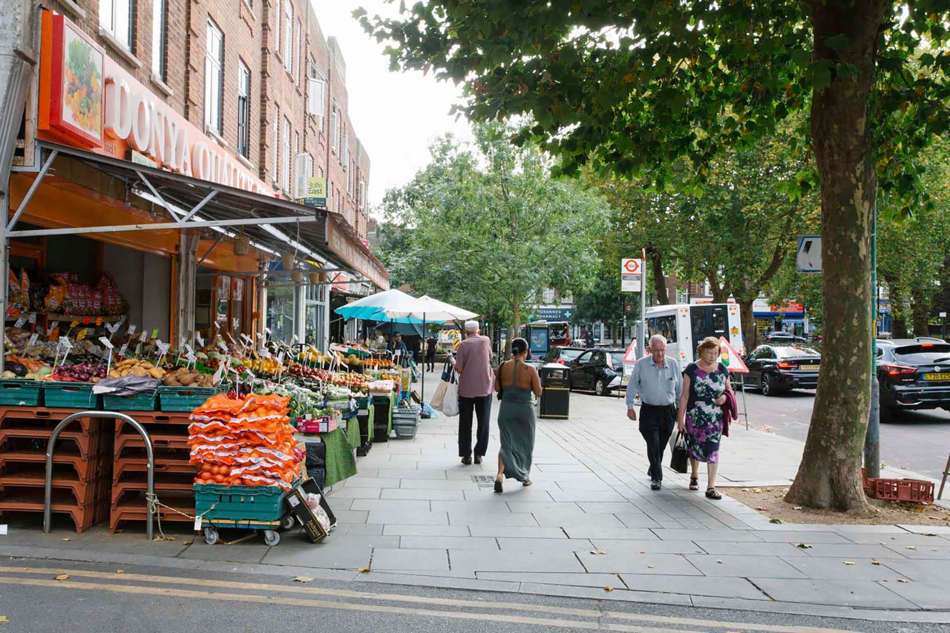Greenford Broadway shops with a greengrocer's fruit and veg display