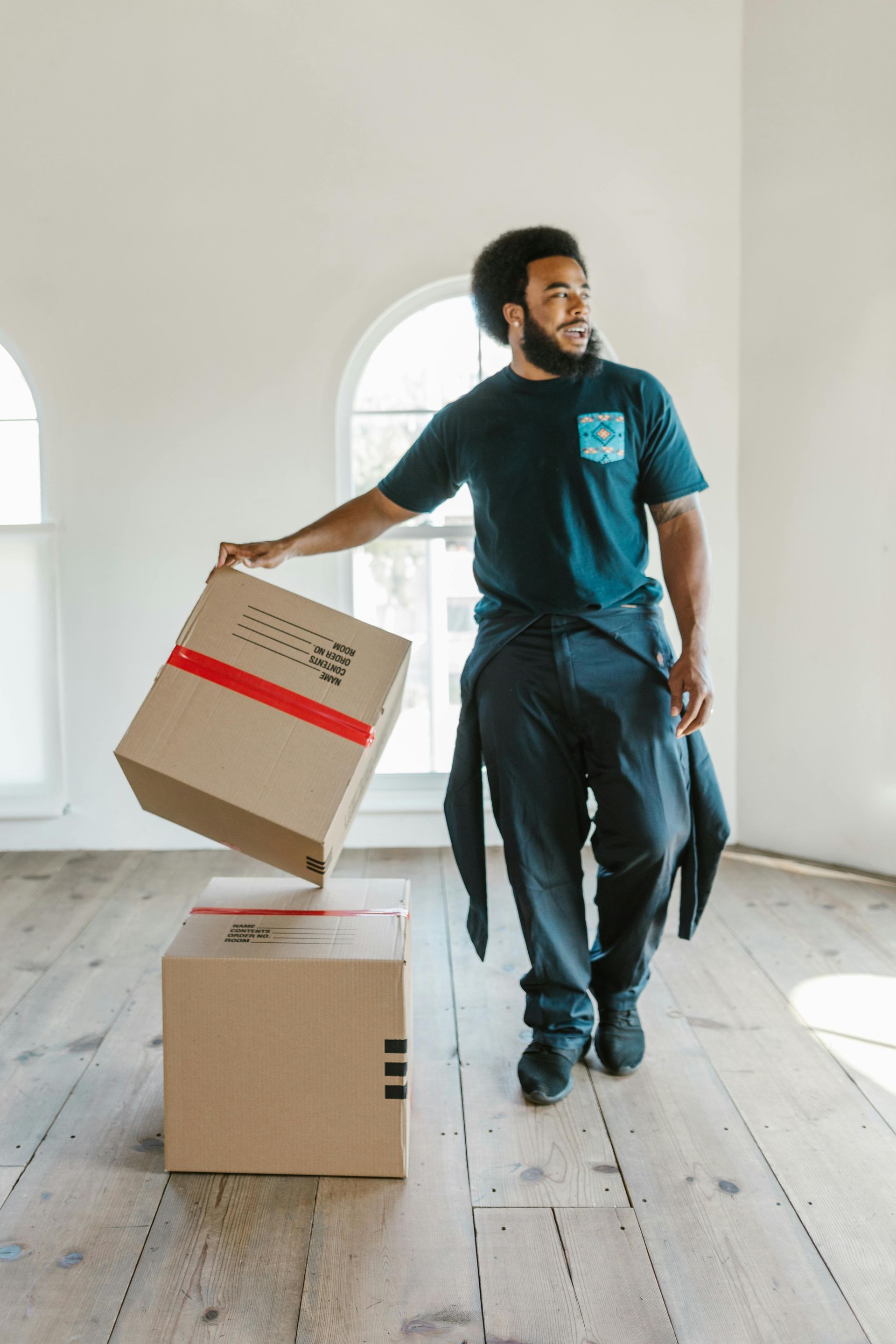 Happy man smiling while preparing for an eco-friendly house move