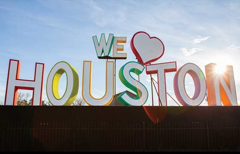 A sign that says we love Houston on it.