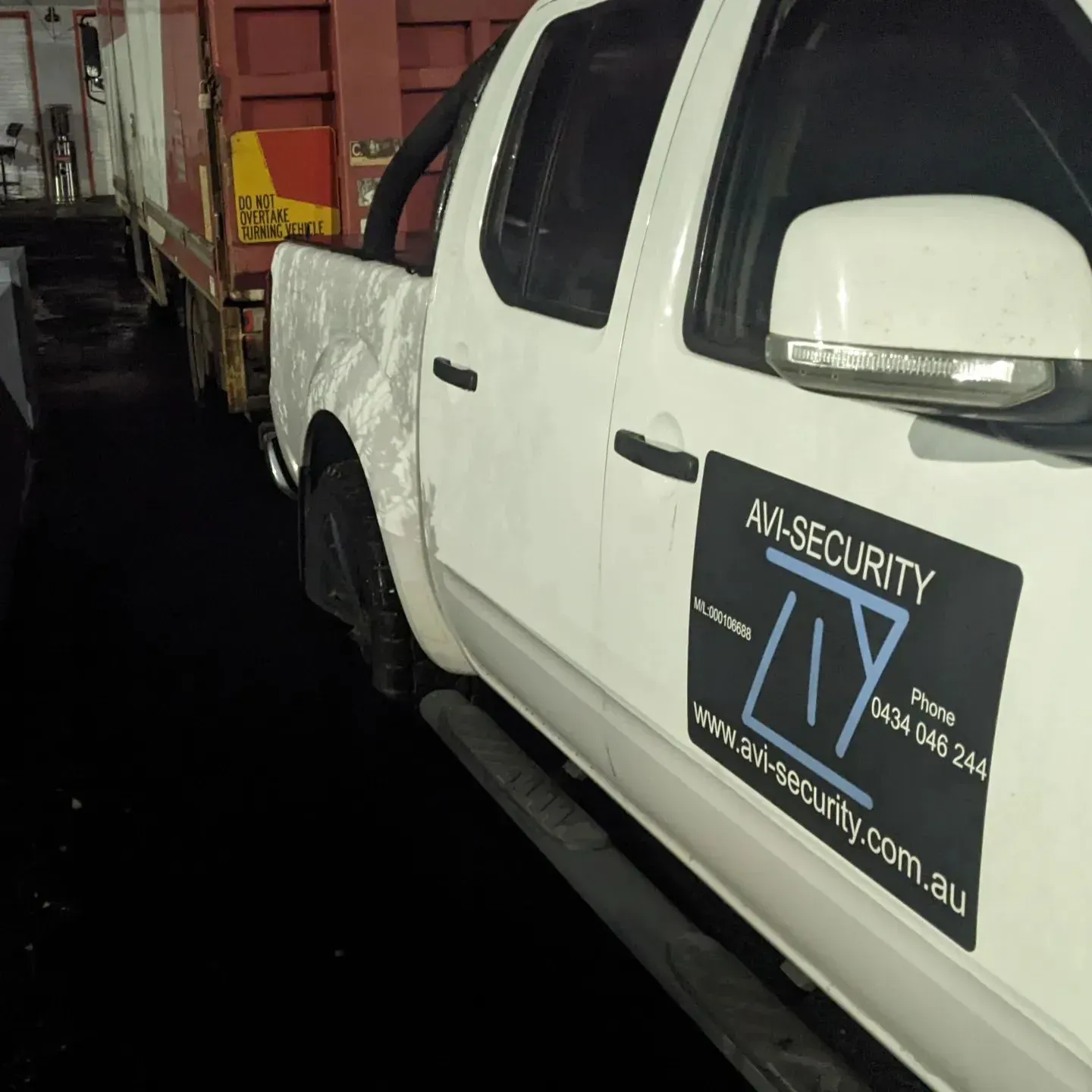 A White Truck With Av-security Written on the Side — AVI Protection Group Pty Ltd in West Kempsey, NSW