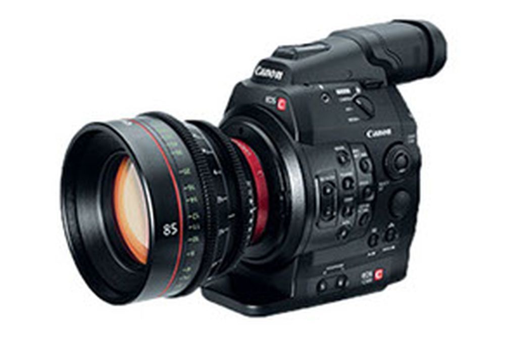 A canon camera with a lens attached to it.