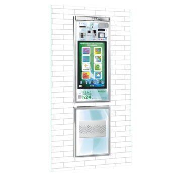 Un telefono è appeso a un muro di mattoni bianchi.