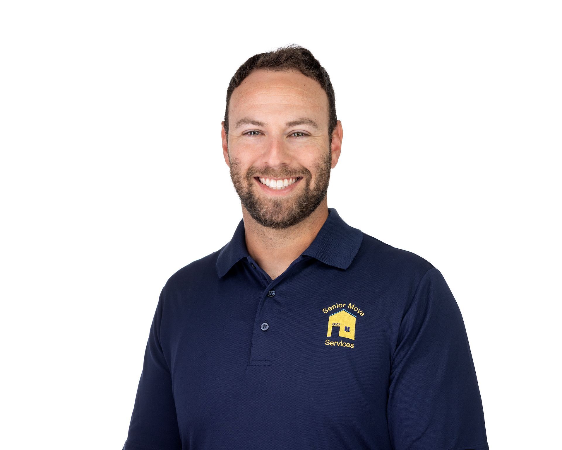 Senior move manager with a beard wearing a blue polo shirt, smiling, with a company logo on the chest.