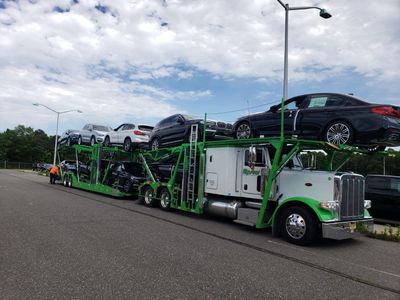 White truck transporting vehicles — Perth Amboy, NJ — Master Auto Transport White truck transporting vehicles — Perth Amboy, NJ — Master Auto Transport