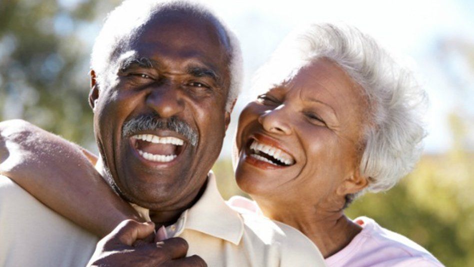 Smiling middle age woman at the dentist for preventative dental care