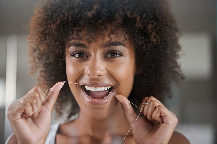 Smiling middle age woman at the dentist for preventative dental care