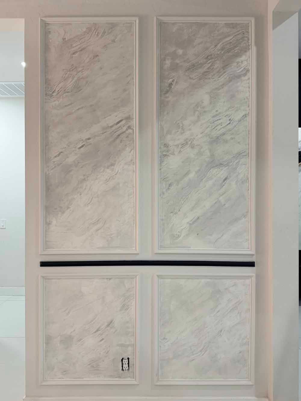 White paneled interior door with four frosted-looking painted panels and a black horizontal trim line.