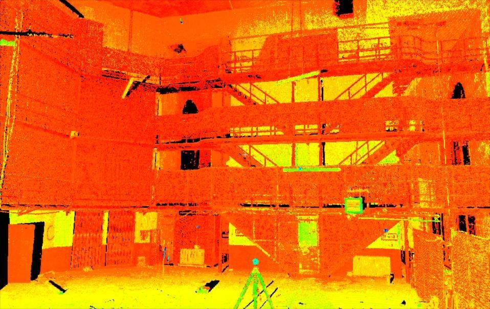Orange-tinted view of a building facade with multiple balconies and railings, seen through heavy glare or thermal effect