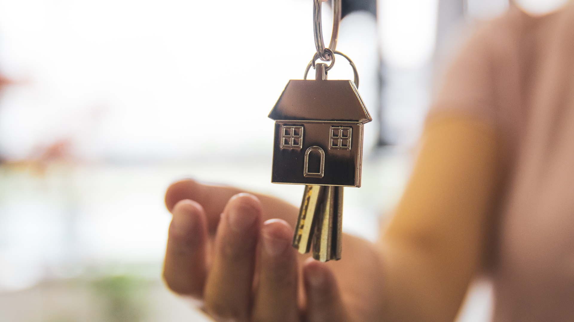 New home keys while buying a house that needs an asbestos survey