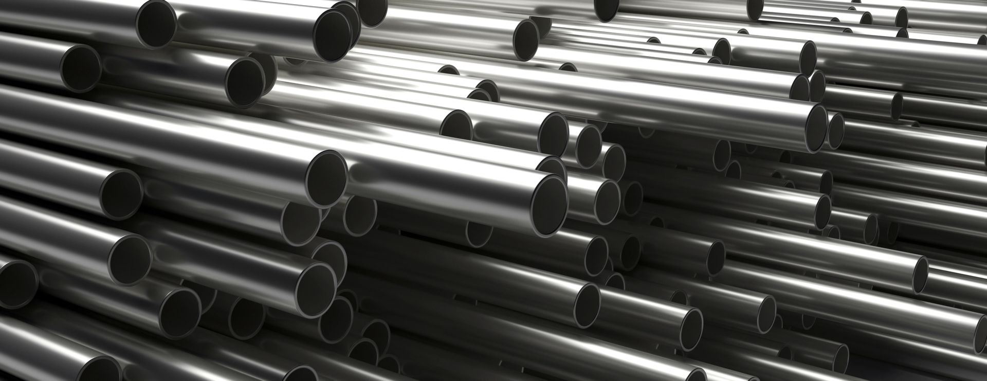 Stainless steel pipes stacked in inventory, ready for fabrication and industrial applications.