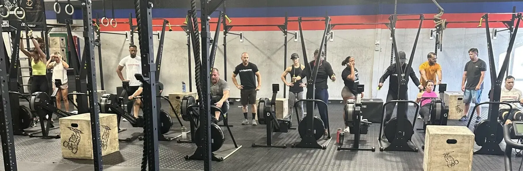 A group of people are working out in a gym.