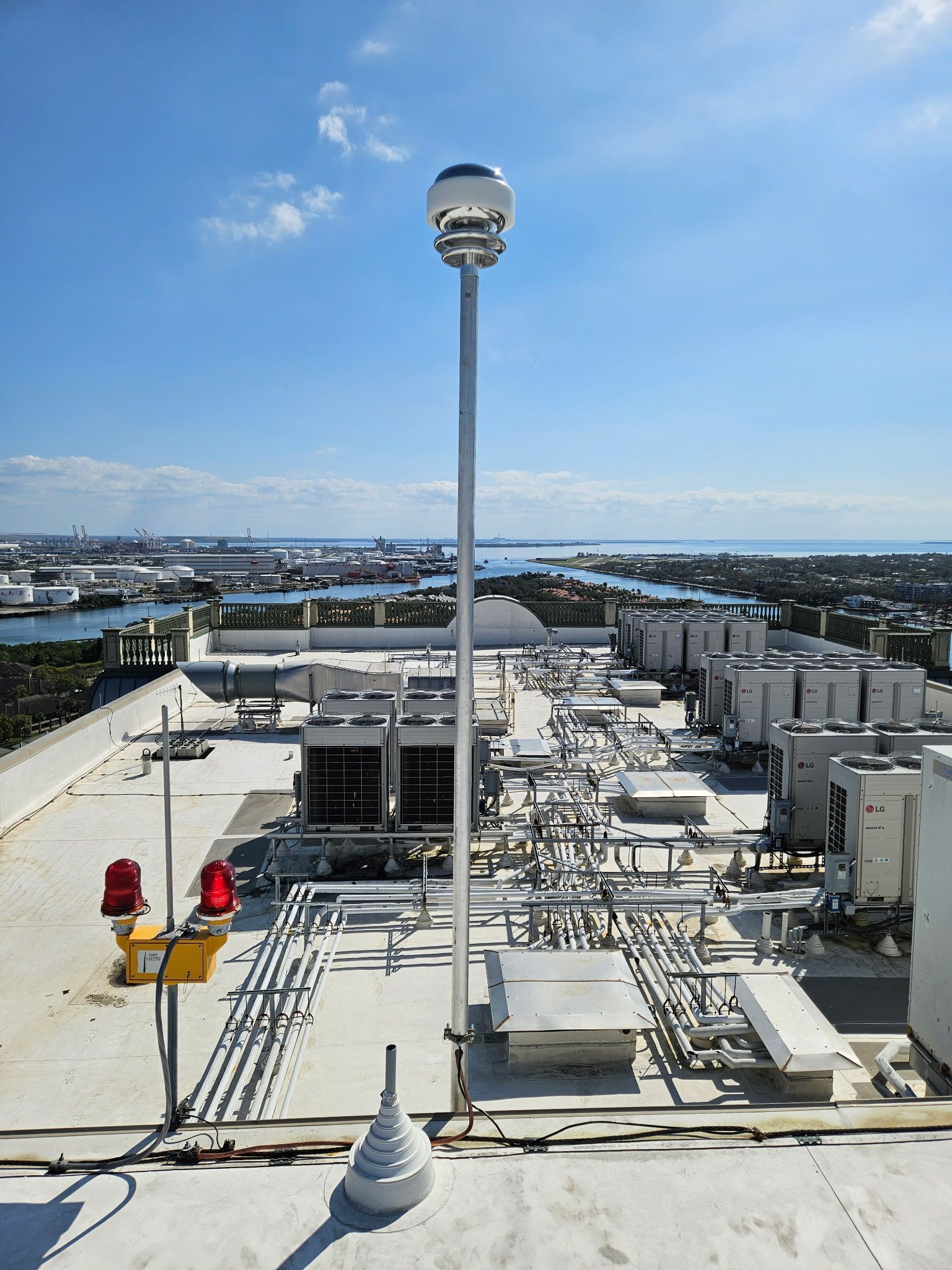 CMCE Lightning Suppressor installed on a mast on top of an apartment building