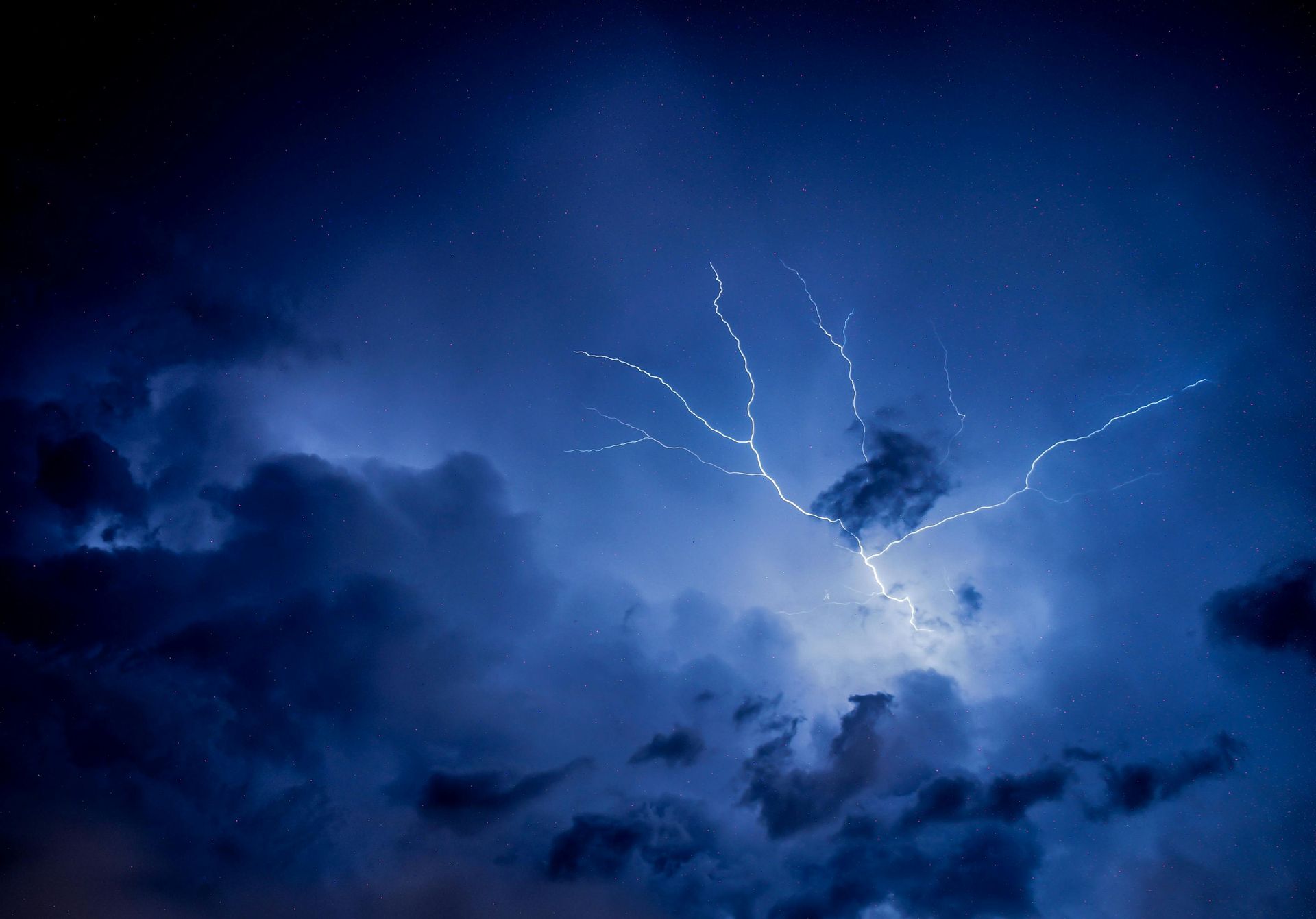 Lightning striking in a thundercloud at night