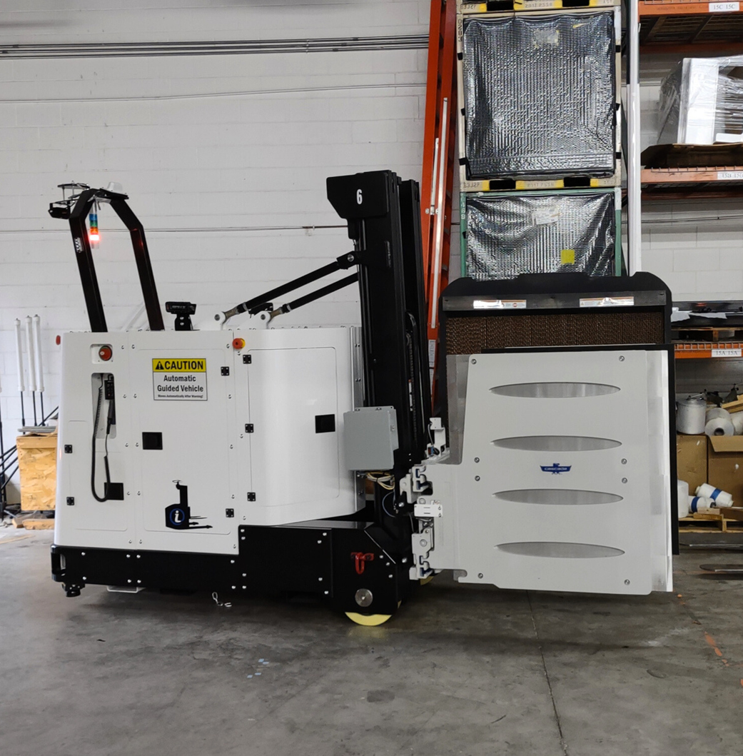 A white machine with a yellow warning sign on it