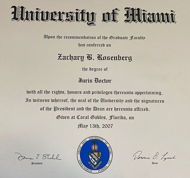A diploma from the university of miami sits on a table