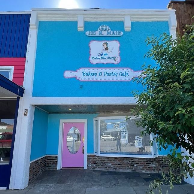 A bakery and pastry cafe with a pink door